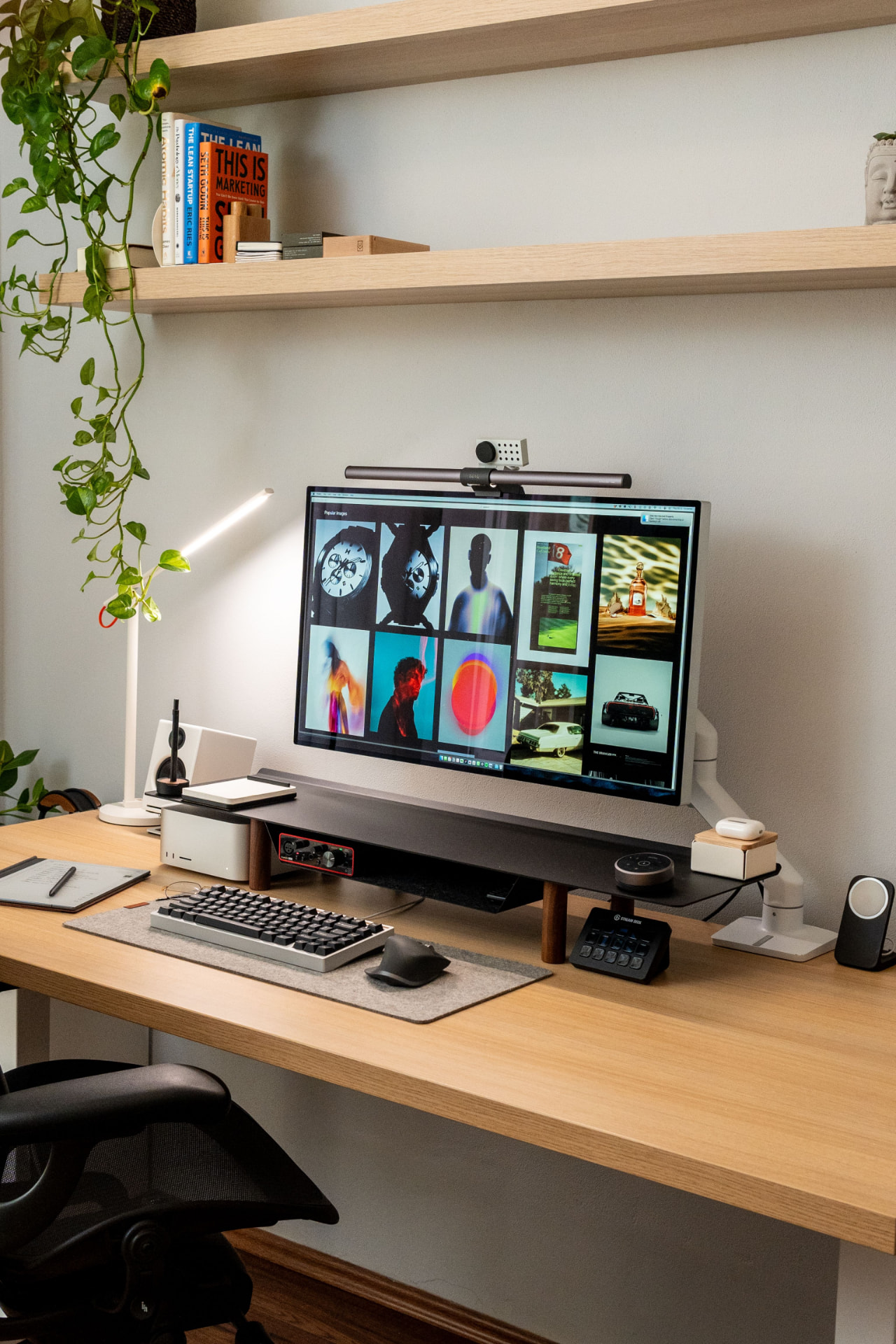 Tidy home office desk with a monitor displaying design work