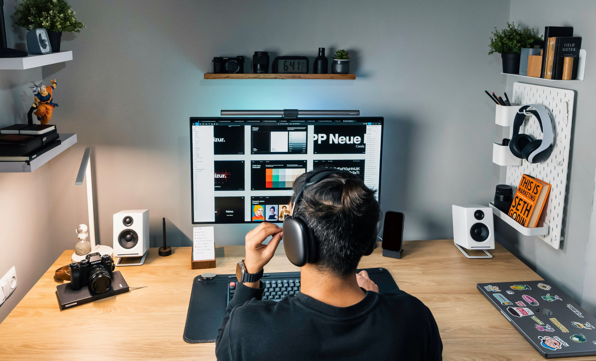 Designer working on a website layout at a modern desk setup