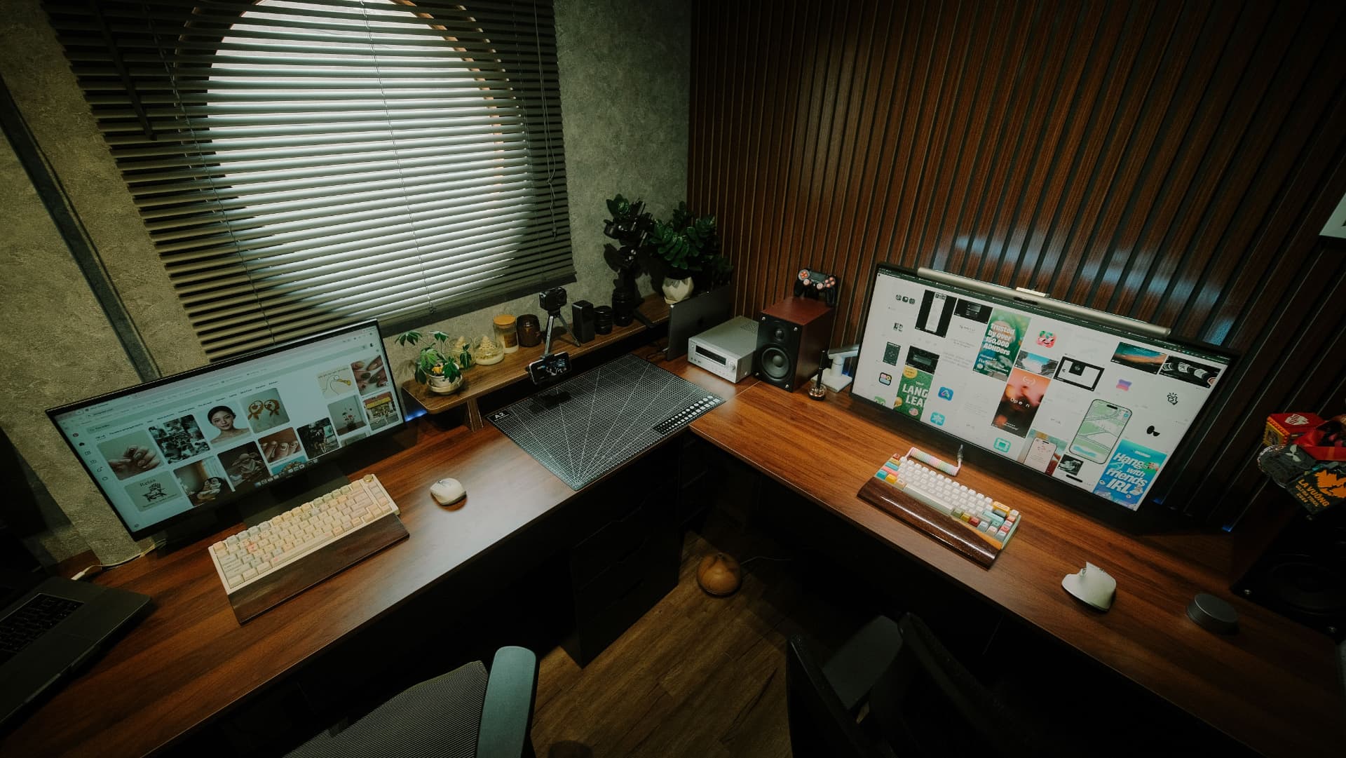 Two-monitor desk setup showing website designs in progress